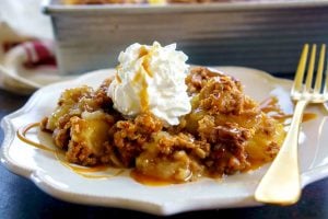 Easy apple crisp recipe with whipped cream and salted caramel sauce!