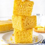 Three pieces of Sour Cream Cornbread stacked on top of each other.