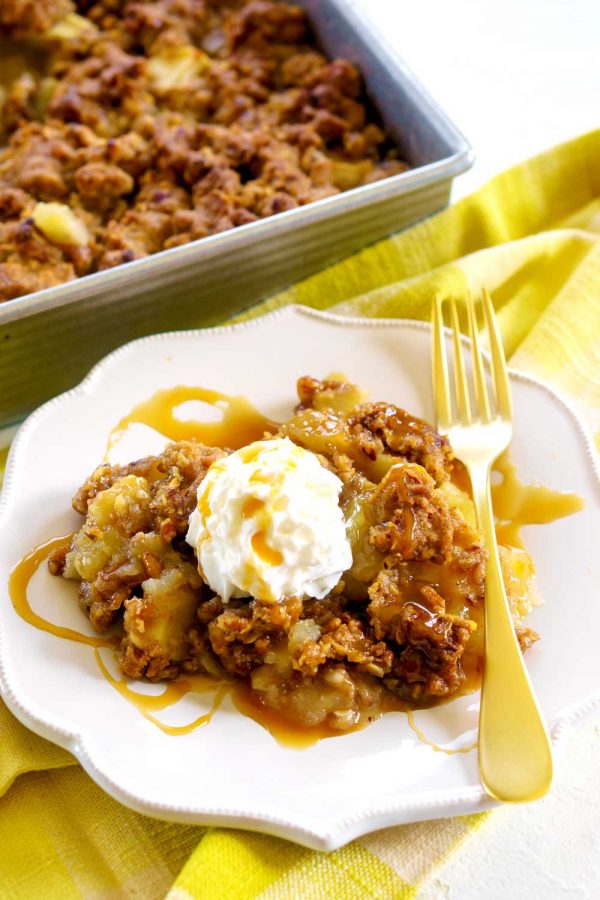 Apple Crisp with caramel and whipped cream.
