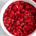 Stir the cherry pie filling, tart cherries, and glaze together in a bowl.