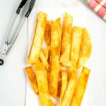 Fry tortilla strips in canola oil and sprinkle with salt.