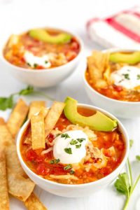 Tortilla soup in bowls ready to eat.
