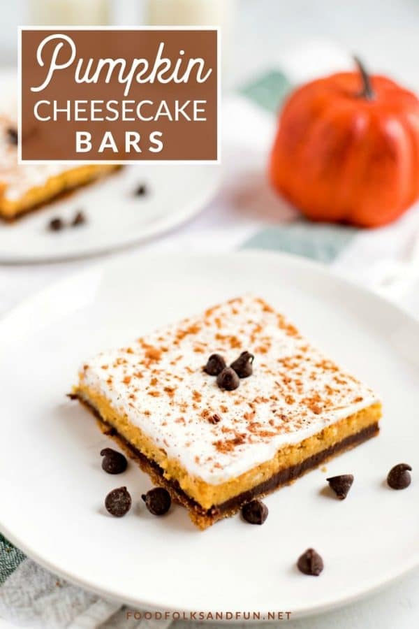 The finished pumpkin cheesecake bar on a white plate with text overlay on the picture for Pinterest. 