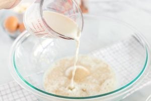 The flour being mixed together with the yeast mixture.