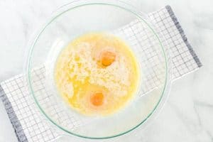 The flour, milk, and egg in a mixing bowl.