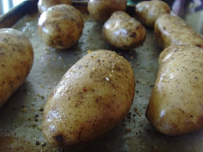 Potatoes on a baking sheet before they go into the oven. 
