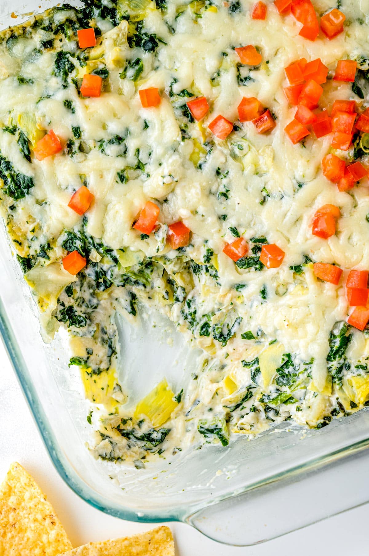 The finished Spinach and Artichoke Dip in a casserole dish.