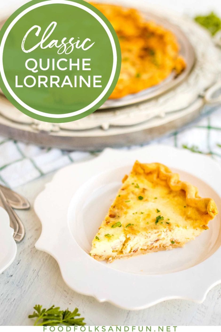 Quiche Lorraine slice on a white plate. 