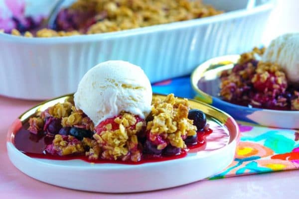 Mixed Berry Crisp on serving plates.
