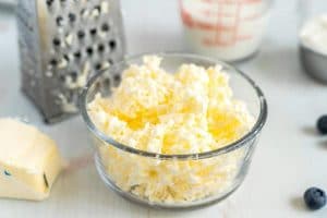 Grate the frozen butter and freeze it for at least 30 minutes.