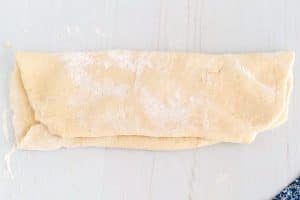 Fold the scone dough into thirds.