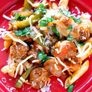 A plate of sausage and peppers pasta