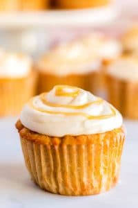 Close up picture of a caramel apple cupcake.