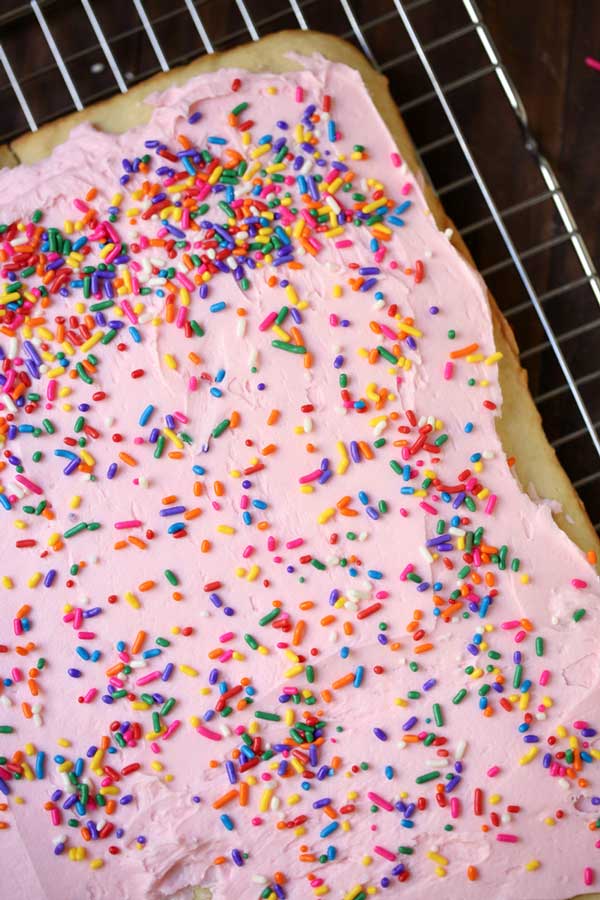process shot for sprinkling sprinkles on top of sugar cookie bars