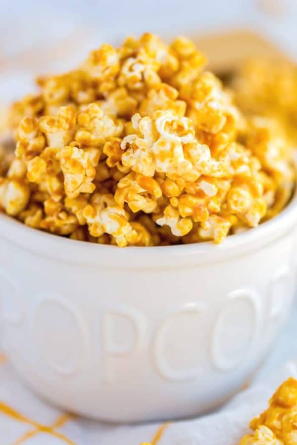Closeup picture of caramel corn in a popcorn bowl. 