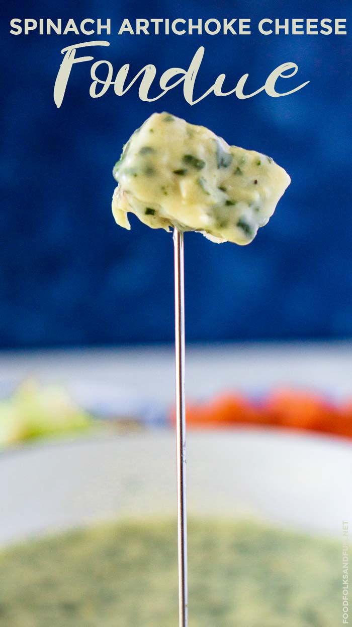 Bread dipped in Cheese Fondue