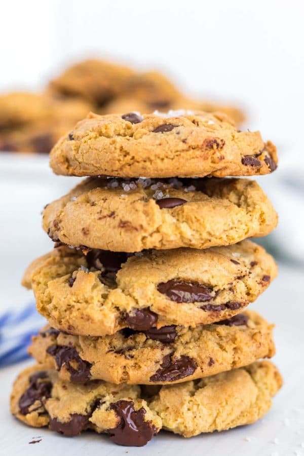 Chocolate Chip cookies stacked on top of each other. 