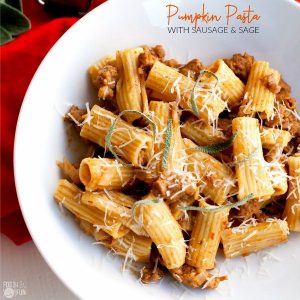 Pumpkin pasta in a bowl with text overlay for Pinterest