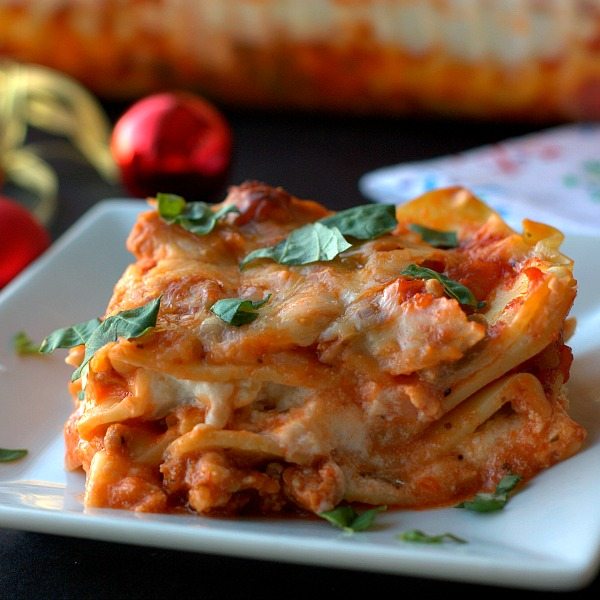A slice of lasagna on a plate. 