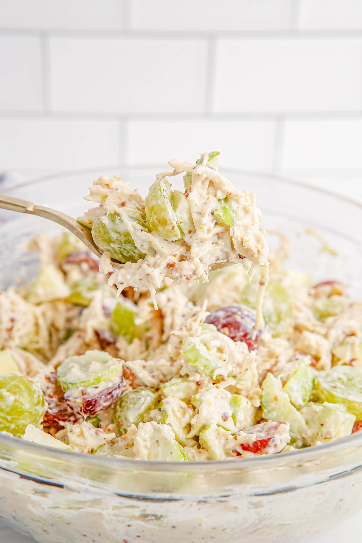 A bowl full of filling for Waldorf Chicken Salad Wraps.