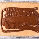 Pour the chocolate over the peanut butter layer and smooth into an even layer. Chill for 1 hour.