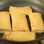 Strawberry and Cream Blintzes in a skillet
