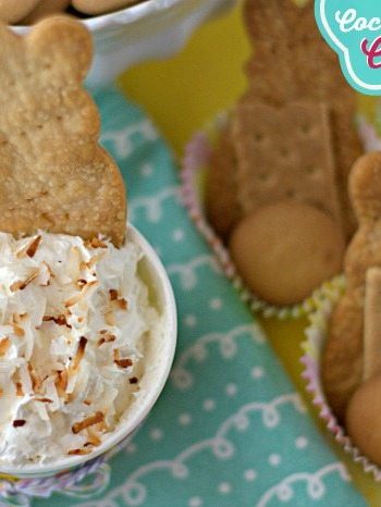 Coconut Cream Pie Cheesecake Dip in a small bowl with dipping crackers with text overlay for Pinterest