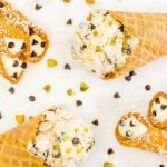 An overhead picture of 2 ice cream cones filled with cannoli ice cream.