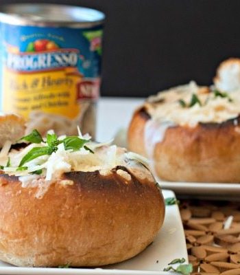 Parmesan Bread Bowls on a plate with a can of soup in the background