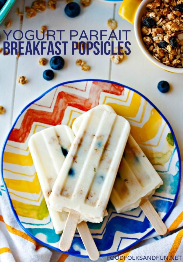 An overhead picture of yogurt popsicles on a colorful plate. The picture has text overlay for Pinterest. 
