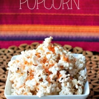Spiced Parmesan Popcorn in a bowl with text overlay for Pinterest