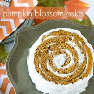Pumpkin blossom cake on a serving plate with text overlay for Pinterest