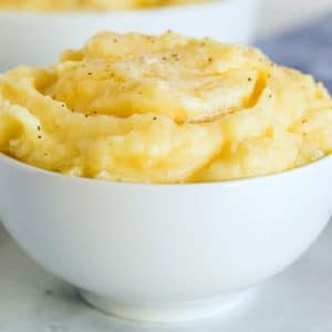 Close up picture of mashed potatoes in a serving bowl.