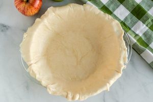 Line a deep dish pie plate with a pie crust.