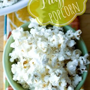 A bowl of truffle popcorn in a bowl with text overlay for Pinterest