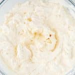 A close up overhead picture of the finished Whipped Cream Cheese Frosting recipe in a mixing bowl.