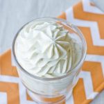 Whipped cream and cream cheese frosting in a glass