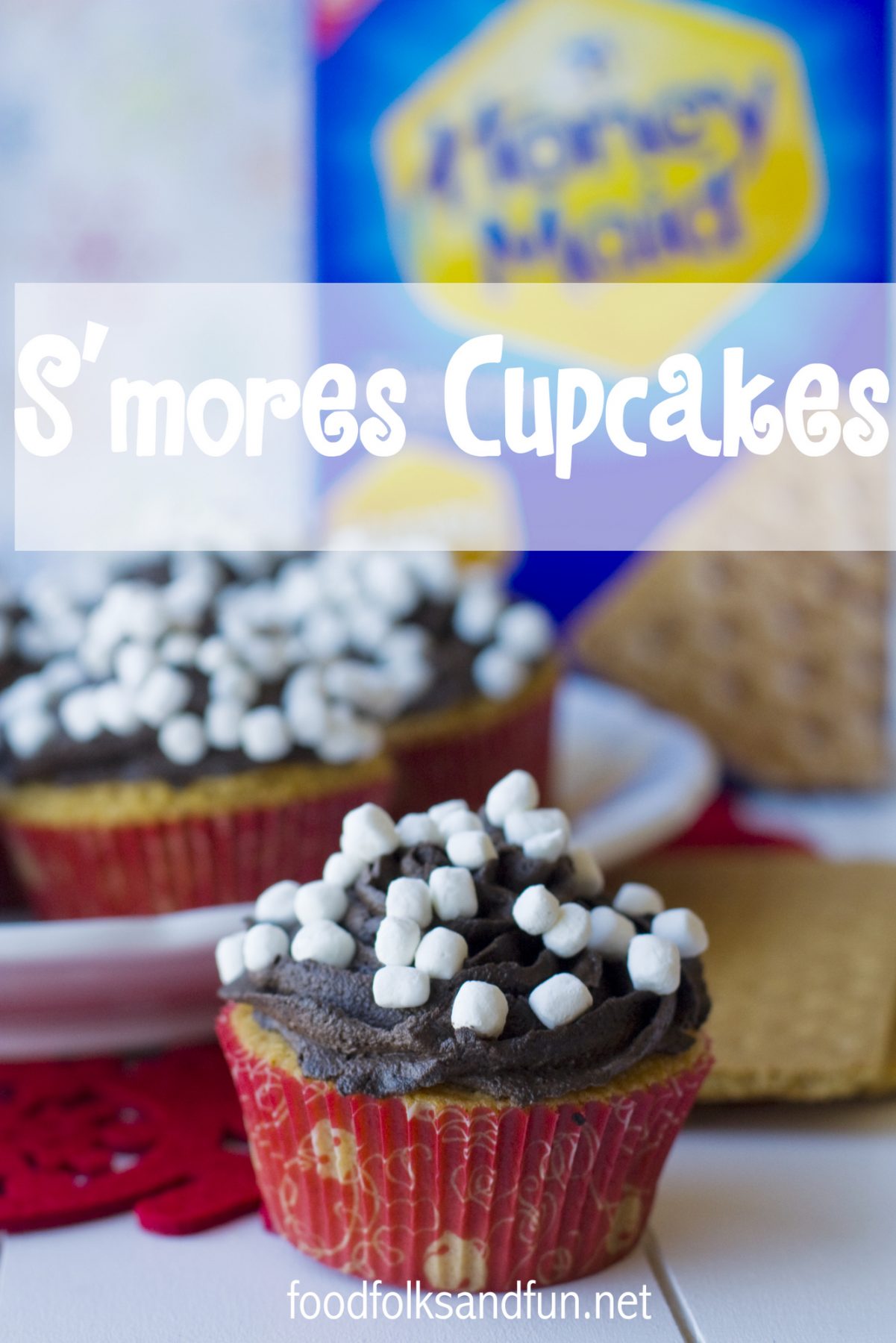 Graham cracker Smore Cupcakes Recipe with milk chocolate buttercream plus a tutorial on How to Make Holiday Graham Cracker Houses. via @foodfolksandfun