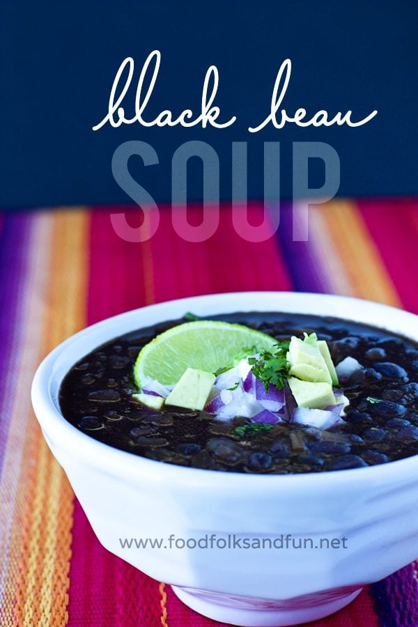 A bowl of black bean soup with text overlay for Pinterest