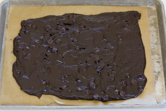 Use an off set spatula to spread the brownie batter.