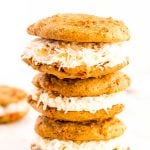 Carrot Cake Whoopie Pies filled to the brim with Coconut Cream Cheese Frosting