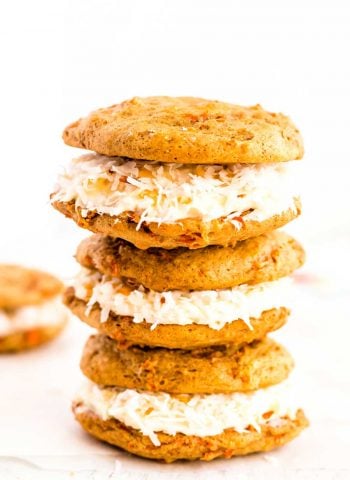 Carrot Cake Whoopie Pies filled to the brim with Coconut Cream Cheese Frosting