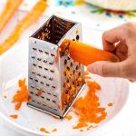 This is how you grate carrots with a box grater.