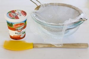 Tools needed to strain ricotta cheese