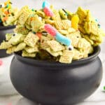 Halloween Chex Mix in a black serving bowl.