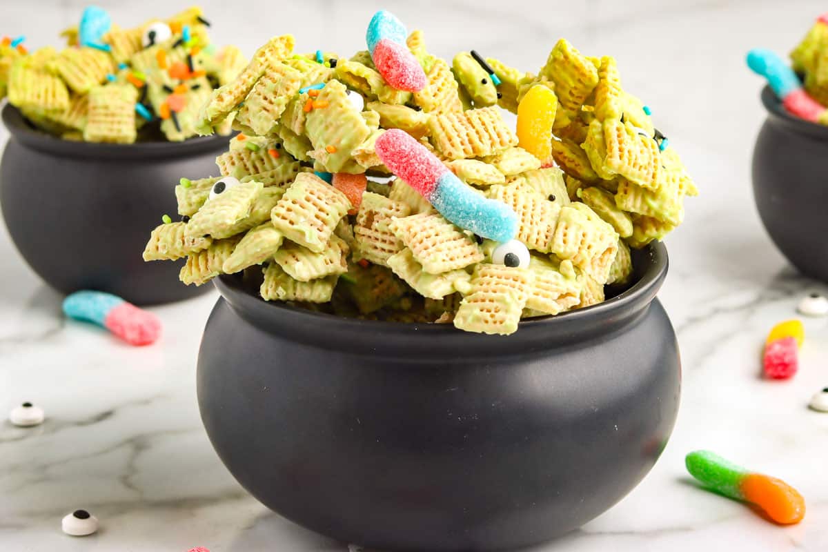 Checx mix in a black plastic cauldron.