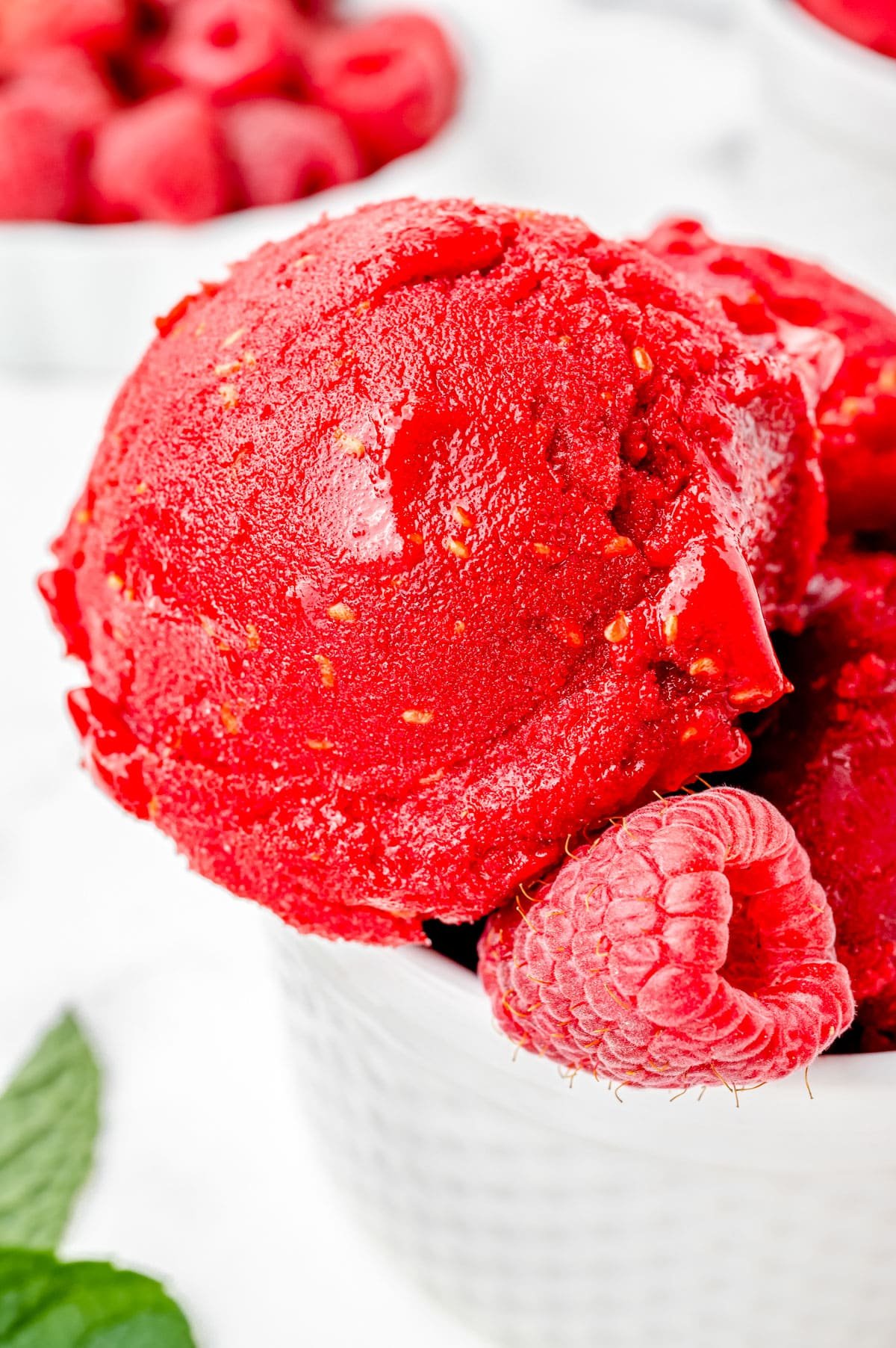 A close up picture of a scoop of Raspberry Sorbet.