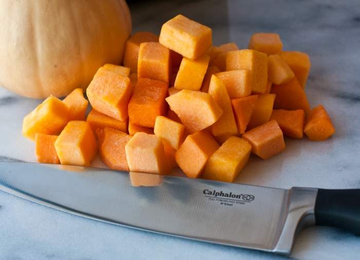 Cut butternut squash with a chef\'s knife