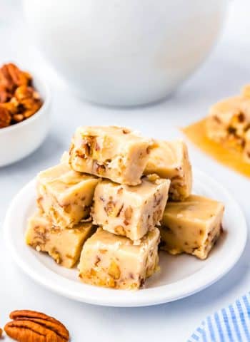 A pile of the finished Butter Pecan Fudge on a white plate.