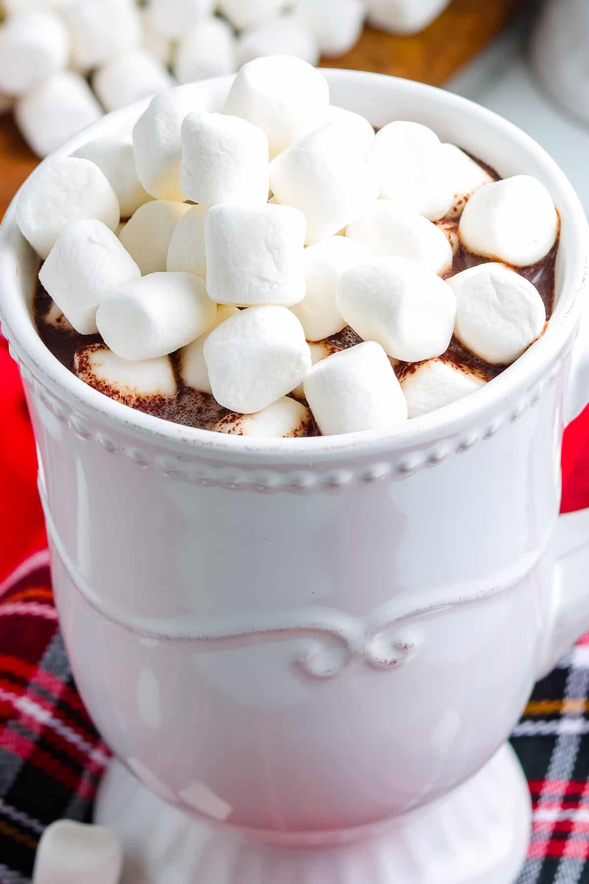 A cup of hot chocolate made with homemade hot chocolate mix and then garnished with marshmallows.